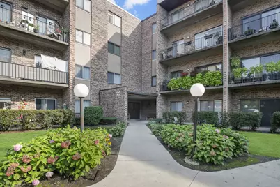 725 W Huntington Commons Road #306, Mount Prospect, IL 60056 - Photo 1