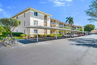 7025 Dennis #202, Naples, FL 34104 - Photo 1