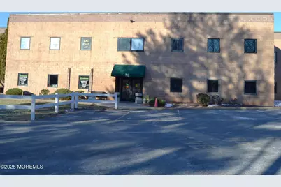 712 Ginesi Drive #2, Morganville, NJ 07751 - Photo 1