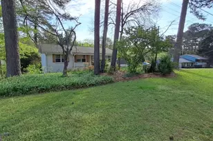 490 Village Green Ct SW, Lilburn, GA 30047 - Photo 3