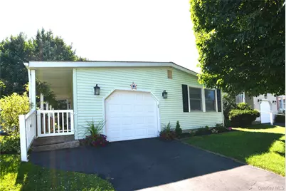 105 W Village Circle #105, Manorville, NY 11949 - Photo 1