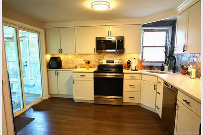 105 W Village Circle #105, Manorville, NY 11949 - Photo 7