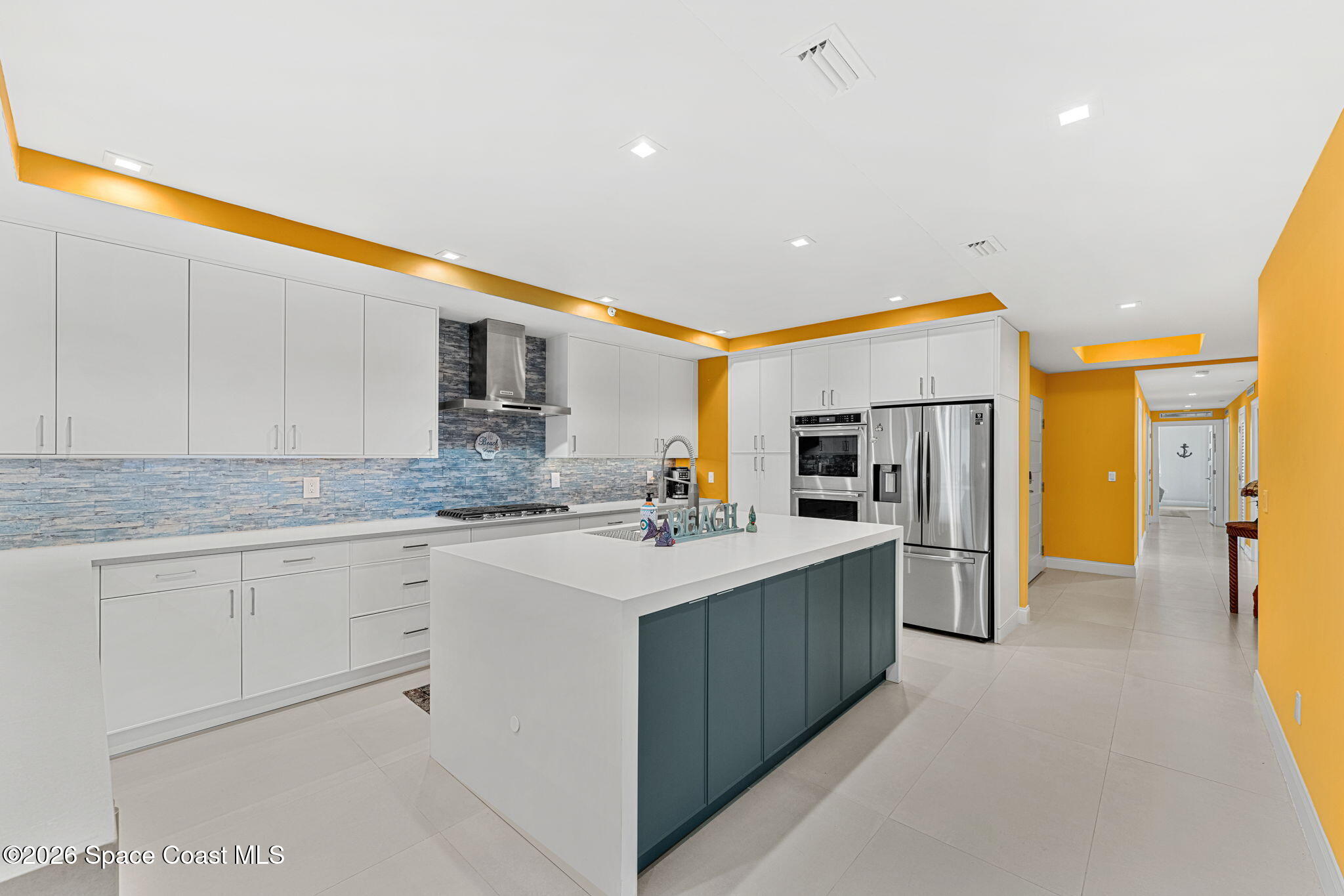 Chef's kitchen with island and stainless appliances
