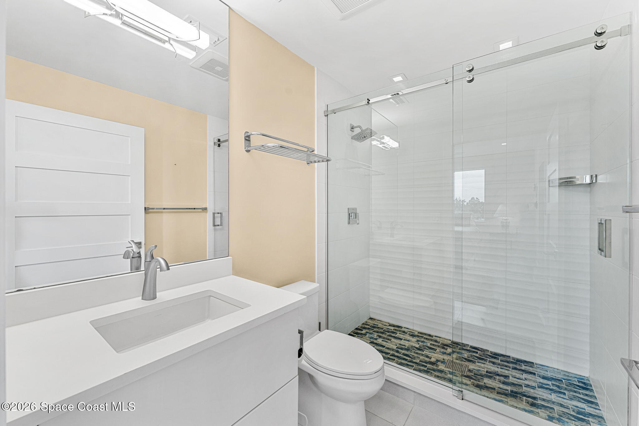 Spa-inspired bath with glass walk-in shower