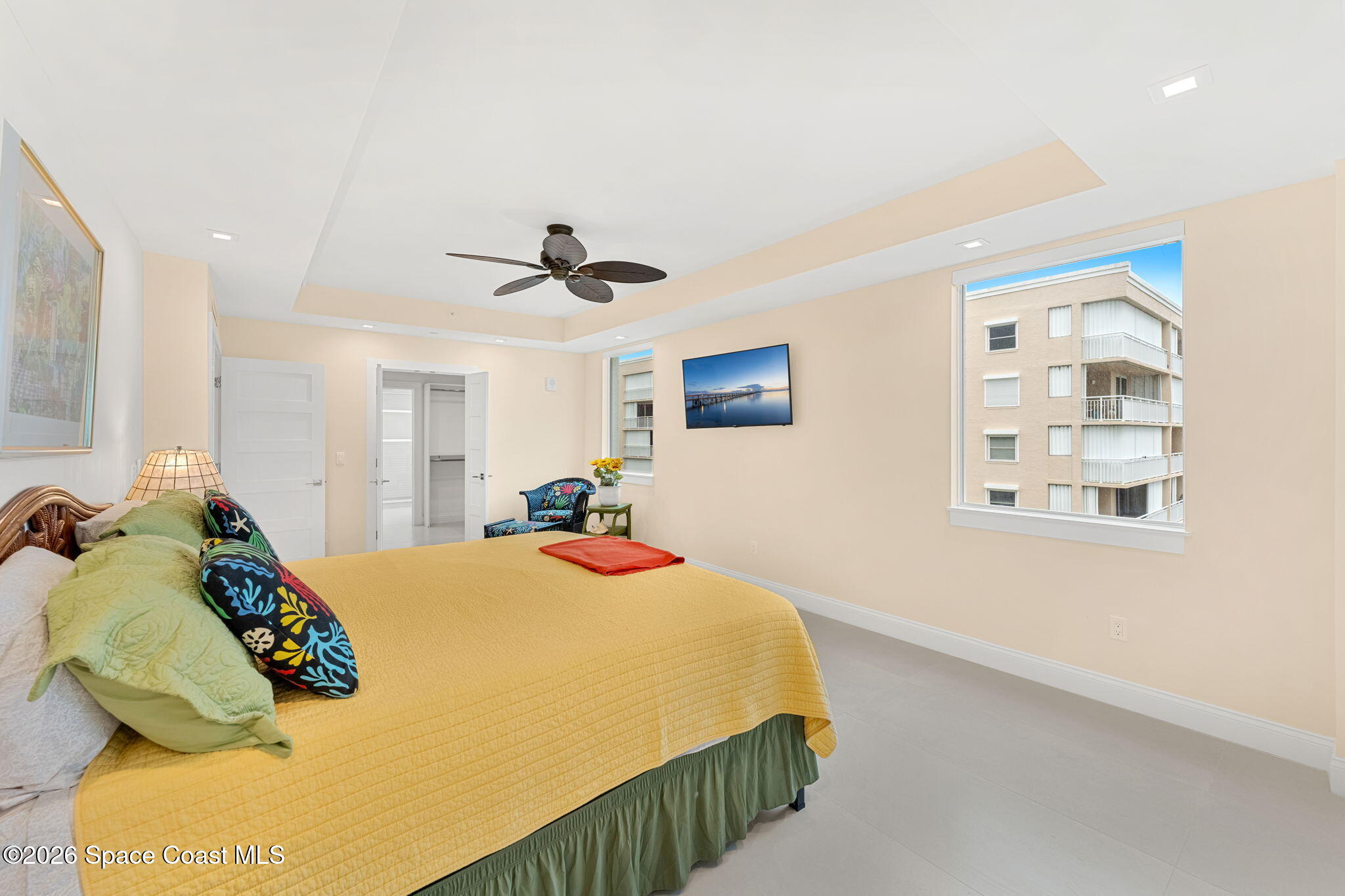Second bedroom suite with ocean view and ceiling fan