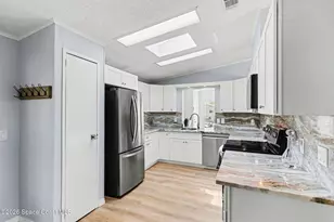 614 Hyacinth Cir, Barefoot Bay, FL 32976 - Photo 7