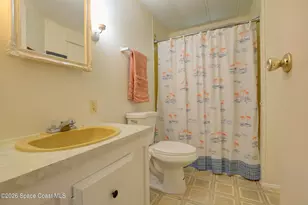 912 Oriole Cir, Barefoot Bay, FL 32976 - Photo 13