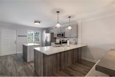 3021 Sandpiper Bay Cir #E106, Naples, FL 34112 - Photo 5