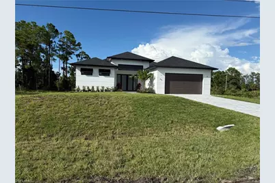 911 Asher St E, Lehigh Acres, FL 33974 - Photo 1