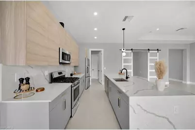 1002 Kanuga St E, Lehigh Acres, FL 33974 - Photo 11