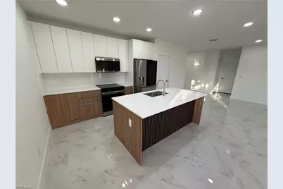 1409 NW 21st Ct, Cape Coral, FL 33909 - Photo 7