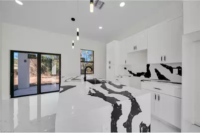 706 Theodore Vail St E, Lehigh Acres, FL 33974 - Photo 13