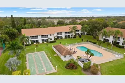 59 Camelot Gardens Blvd #207, Lehigh Acres, FL 33936 - Photo 1