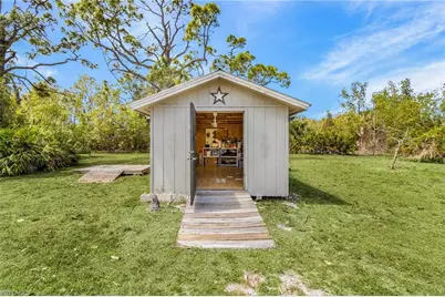 8677 Whispering Pines Dr, Saint James City, FL 33956 - Photo 5