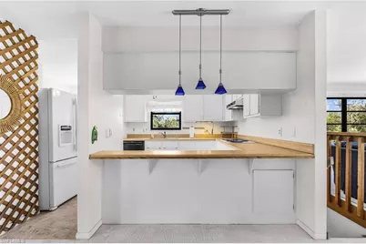 8677 Whispering Pines Dr, Saint James City, FL 33956 - Photo 9