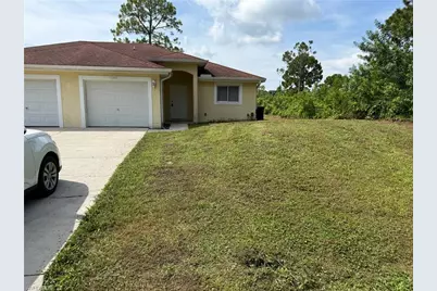 1040 Ainsworth St E, Lehigh Acres, FL 33974 - Photo 1