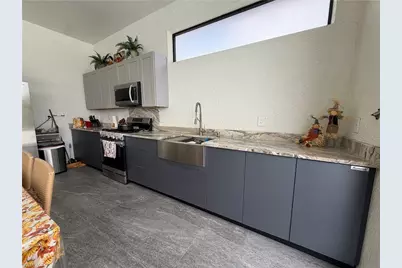 910 Venice Ave N, Lehigh Acres, FL 33971 - Photo 17