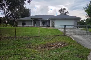 1025 Iris St E, Lehigh Acres, FL 33974 - Photo 1