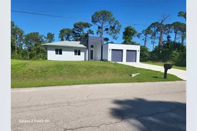 521 Frank Jewett Ave S, Lehigh Acres, FL 33974 - Photo 1