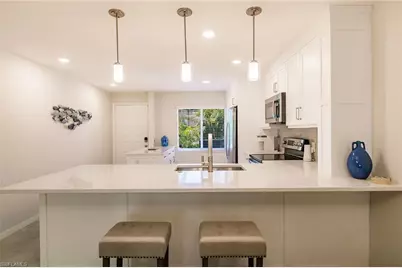 3032 Sandpiper Bay Cir #G102, Naples, FL 34112 - Photo 9