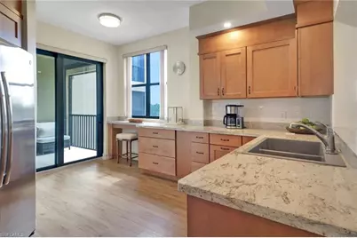 7008 Pelican Bay Blvd #H302, Naples, FL 34108 - Photo 13