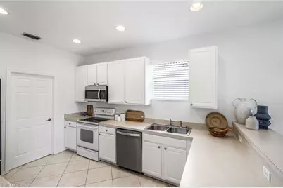 5576 Lago Villaggio Way, Naples, FL 34104 - Photo 11