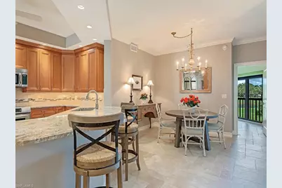 7032 Pelican Bay Blvd #E202, Naples, FL 34108 - Photo 5