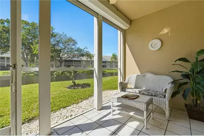 144 Pebble Shores Dr #103, Naples, FL 34110 - Photo 1