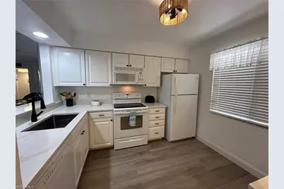 1025 Foxfire Ln #106, Naples, FL 34104 - Photo 3