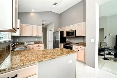 1842 Winding Oaks Way, Naples, FL 34109 - Photo 7