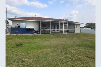 909 Sally Ave N, Lehigh Acres, FL 33971 - Photo 5
