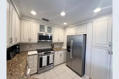 1033 Egrets Walk Cir #6-101, Naples, FL 34108 - Photo 5