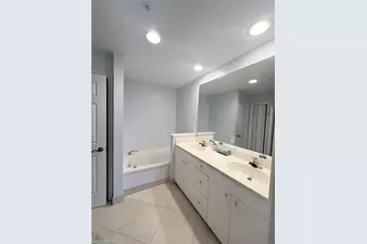 1033 Egrets Walk Cir #6-101, Naples, FL 34108 - Photo 9