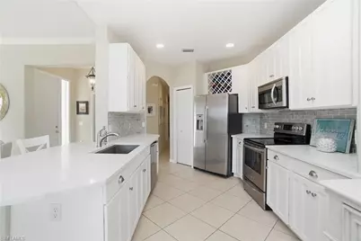 6842 Sterling Greens Dr #102, Naples, FL 34104 - Photo 13