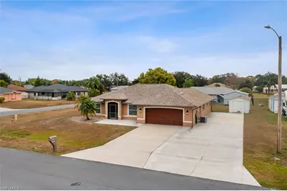 401 Candlewick Cir E, Lehigh Acres, FL 33936 - Photo 1