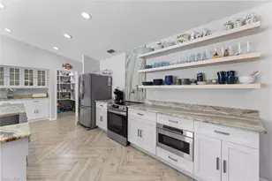 2467 Pinewoods Cir, Naples, FL 34105 - Photo 11