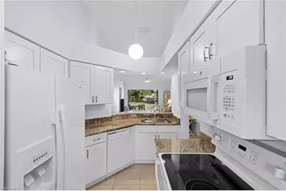 121 Wading Bird Cir #B201, Naples, FL 34110 - Photo 1