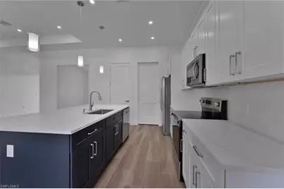 717 Theodore Vail St E, Lehigh Acres, FL 33974 - Photo 7