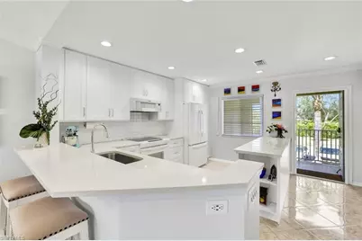 7742 Emerald Cir #V203, Naples, FL 34109 - Photo 1