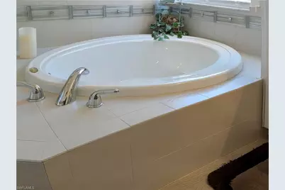 5758 Lago Villaggio Way, Naples, FL 34104 - Photo 31