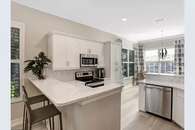 1051 Egrets Walk Cir #7-201, Naples, FL 34108 - Photo 7