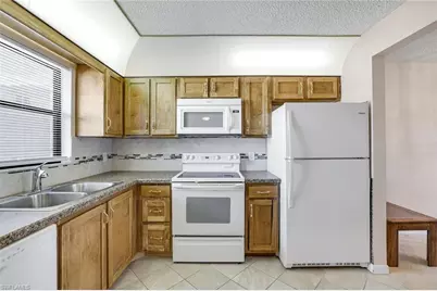 4338 27th Ct SW #104, Naples, FL 34116 - Photo 5