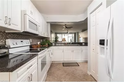 2585 Old Groves Rd #L102, Naples, FL 34109 - Photo 7