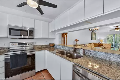 3021 Sandpiper Bay Cir #E206, Naples, FL 34112 - Photo 5