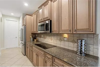 7687 Martino Cir, Naples, FL 34112 - Photo 11