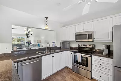 550 Saratoga Cir #E205, Naples, FL 34104 - Photo 13