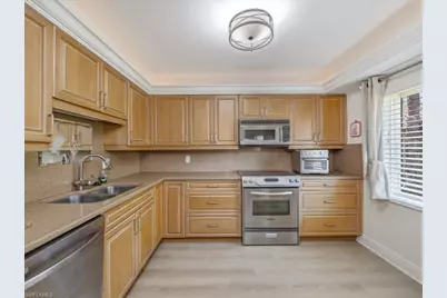 3207 Horse Carriage Way #403, Naples, FL 34105 - Photo 5