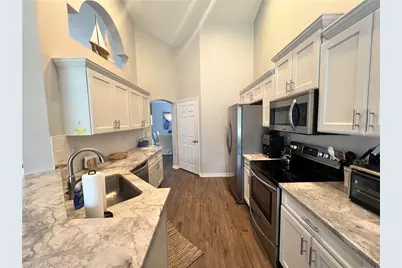 25240 Pelican Creek Cir #202, Bonita Springs, FL 34134 - Photo 7
