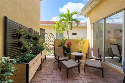 7703 Martino Cir, Naples, FL 34112 - Photo 11