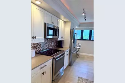 6020 Pelican Bay Blvd #E402, Naples, FL 34108 - Photo 9